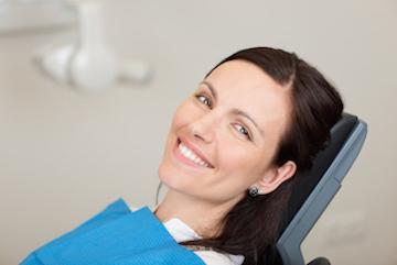 tooth extractions | smiling woman at dedham dentist